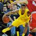 Michigan sophomore Trey Burke looks to move the ball around Ohio State junior Aaron Craft during the first half at Crisler Center on Tuesday, Feb. 5. Melanie Maxwell I AnnArbor.com